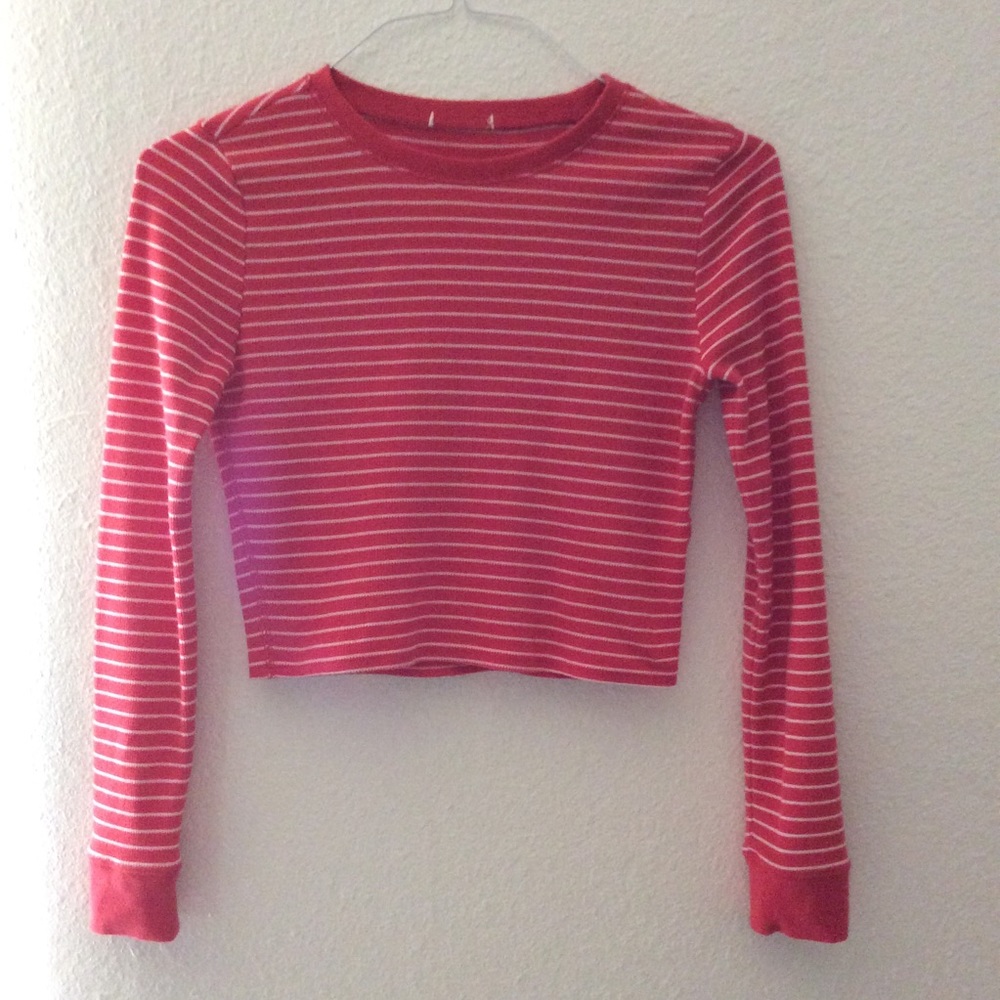 Orange crop top with white stripes.